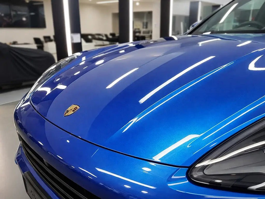 Porsche Macan wrapped in Hexis Gloss HX20000 Metallic Night Blue restyling film HX20905B