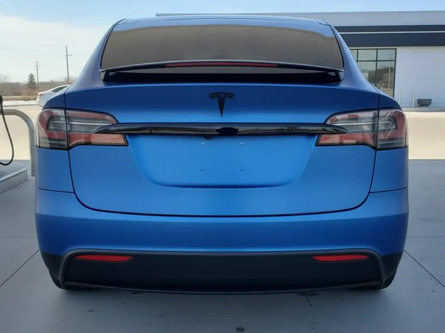 Tesla Y wrapped in Hexis Matte HX20000 Metallic Night Blue restyling film HX20905M