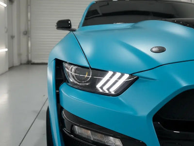 Ford Mustang wrapped in Matte HX20000 Turquoise Blue automotive vinyl film HX20BTUM