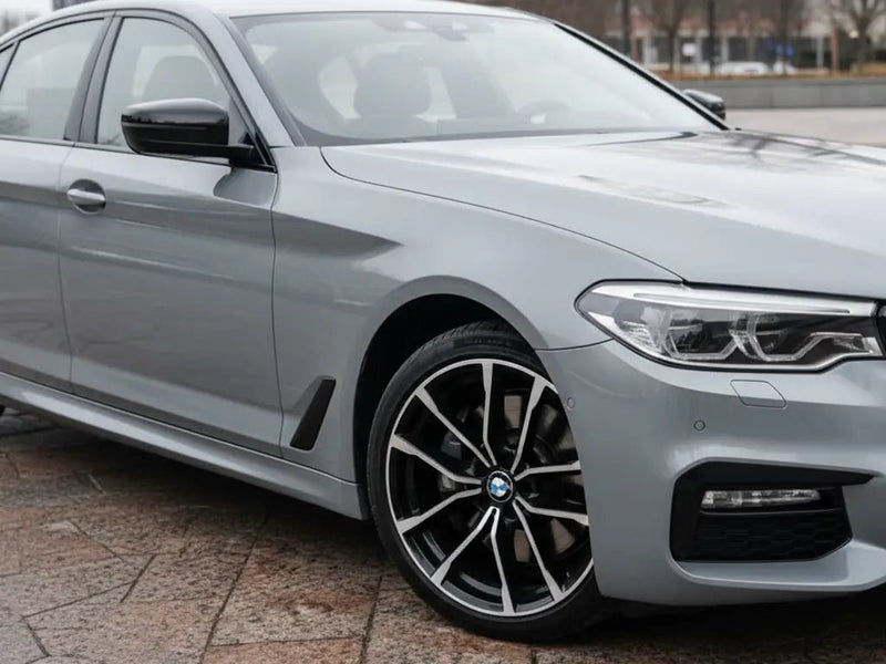 BMW 5 Series wrapped in Hexis Gloss HX20000 Dust Grey vinyl wrap HX20G06B