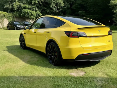 Tesla Y wrapped in Hexis Gloss HX20000 Honey Yellow car wrap film HX20JMIB