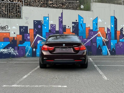 DIY BMW 4 Series wrapped in Gloss HX20000 Vampire Black restyling film HX20N03B