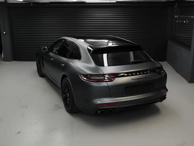 Porsche Panamera wrapped in Matte HX20000 Deep Black wrap film HX20NPRM detail