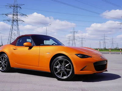 Mazda MX-5 Miata wrapped in Gloss HX20000 Aurora Orange restyling film HX20OAUB