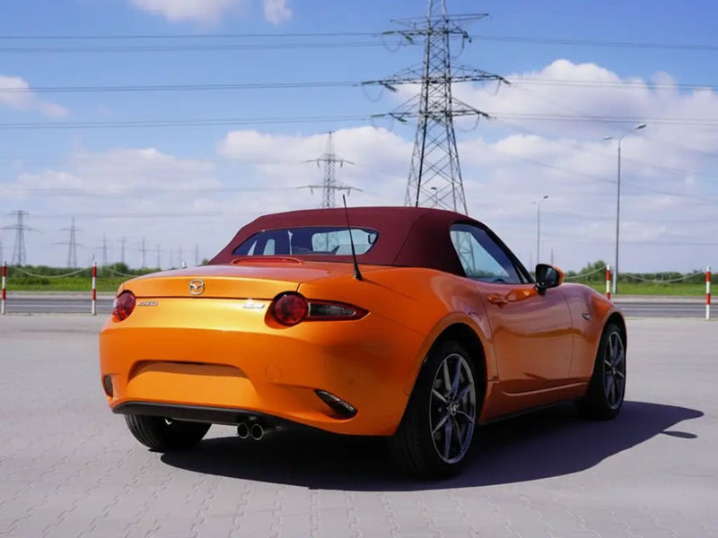 Mazda MX-5 Miata wrapped in Hexis Gloss HX20000 Aurora Orange vinyl wrap HX20OAUB