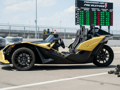 Polaris Slingshot wrapped in Hexis Gloss HX20000 Zeus Gold restyling film HX20P001