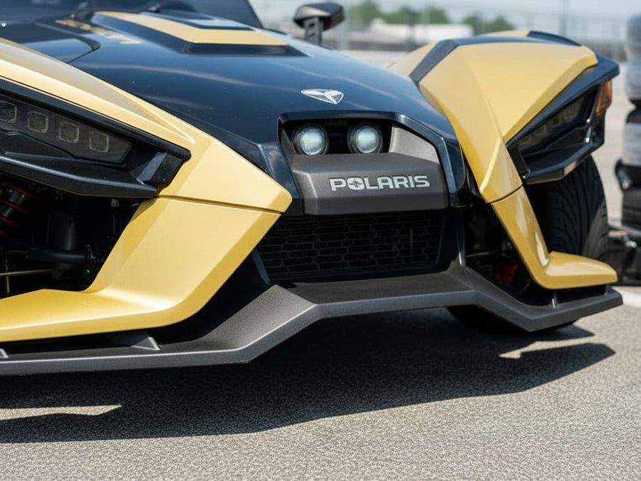 Polaris Slingshot wrapped in Hexis Gloss HX20000 Zeus Gold wrap film HX20P001