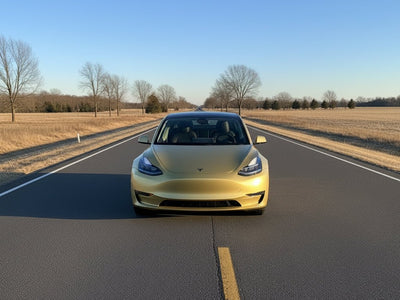 Tesla 3 wrapped in Gloss HX20000 Zeus Gold restyling film HX20P001