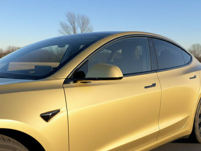 Tesla 3 wrapped in Gloss HX20000 Zeus Gold car wrap film HX20P001