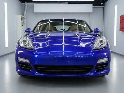 Porsche Panamera wrapped in Gloss HX20000 Triton Blue restyling film HX20P005