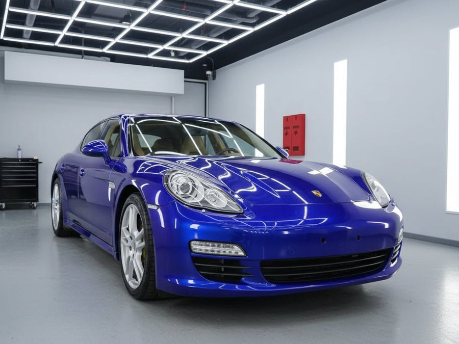 Porsche Panamera wrapped in Hexis Gloss HX20000 Triton Blue automotive vinyl film HX20P005