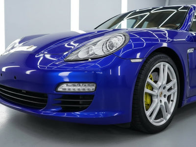 Porsche Panamera wrapped in Hexis Gloss HX20000 Triton Blue wrap film HX20P005