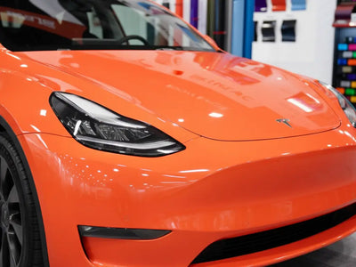 Tesla 3 wrapped in Hexis Gloss HX20000 Light Red automotive vinyl film HX20R21B