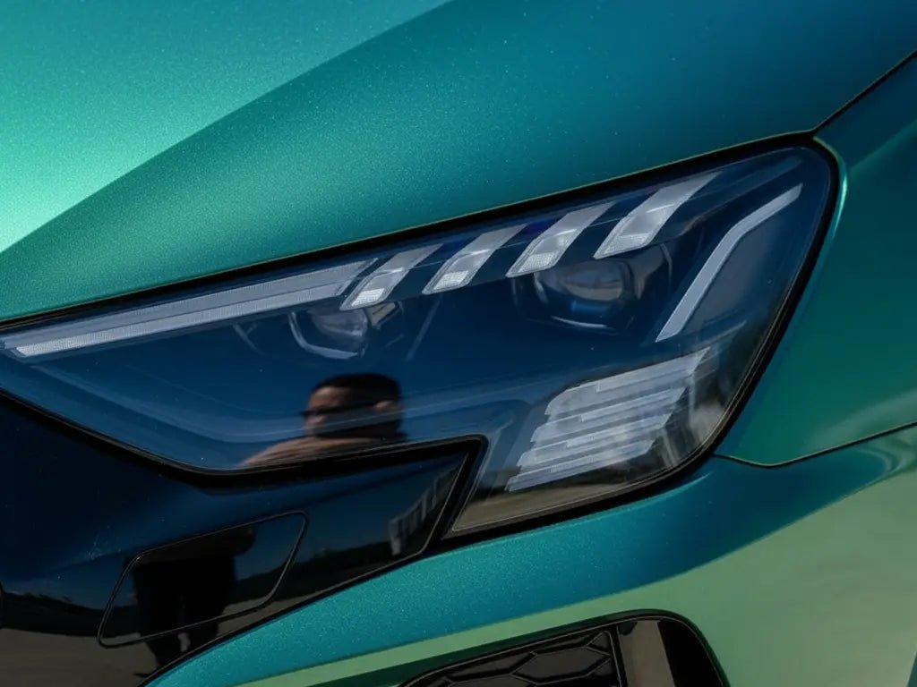 Audi e-tron wrapped in Gloss HX20000 Metallic Century Green automotive vinyl film HX20V19B
