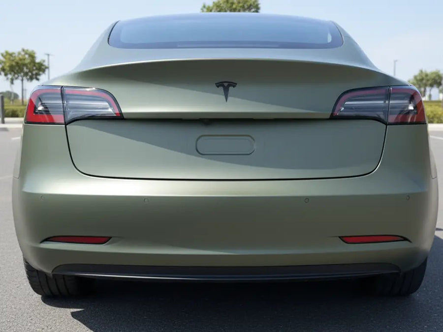 Tesla 3 wrapped in Matte HX20000 Military Green automotive vinyl film HX20VMIM