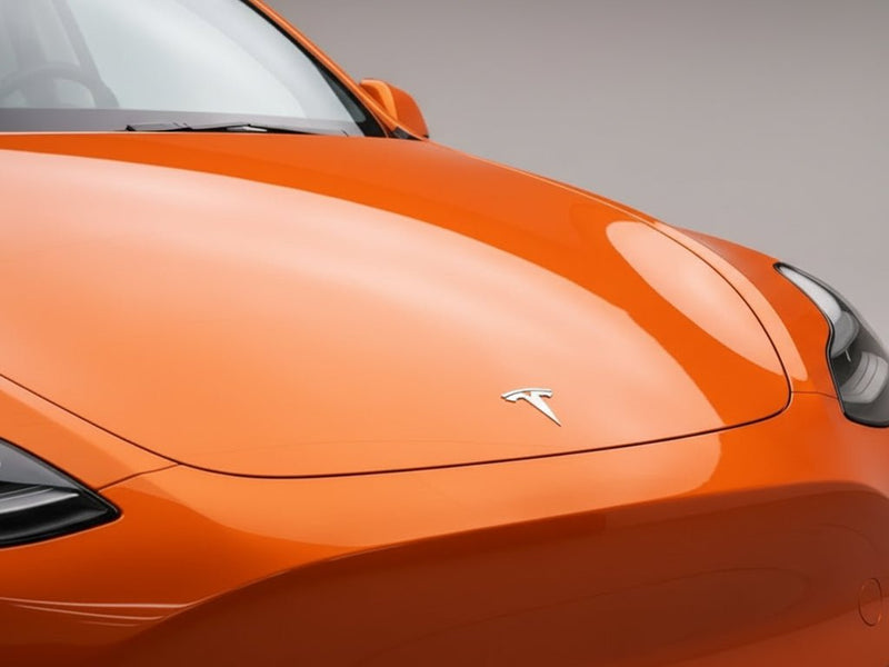 DIY Tesla 3 wrapped in SuperGloss HXONE™ Sunrise Orange vinyl wrap HXONE302