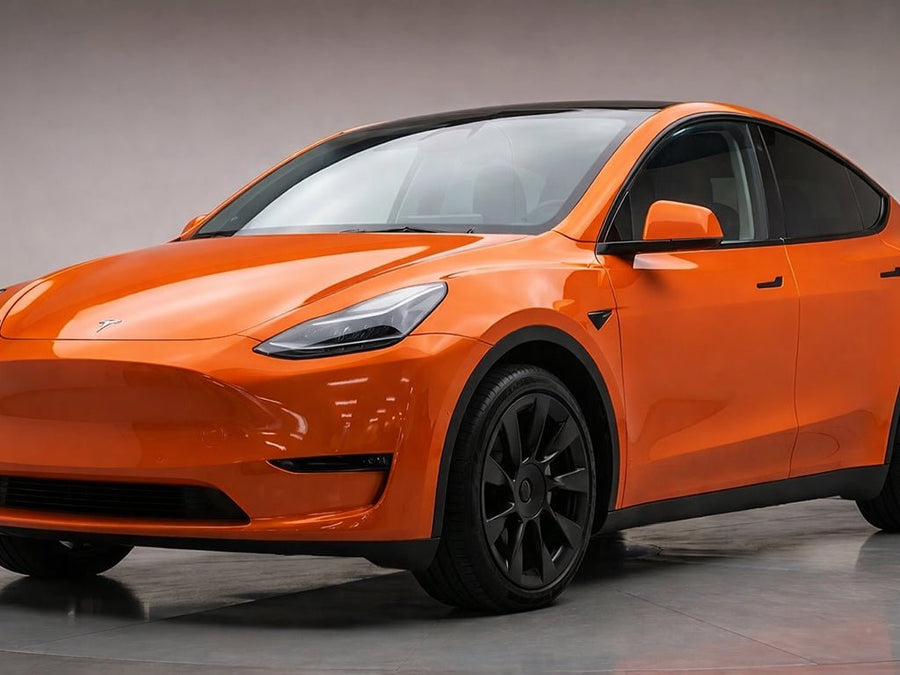 Tesla Y wrapped in Hexis Super Gloss HXONE™ Sunrise Orange car wrap film HXONE302