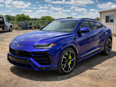 Lamborghini Urus wrapped in Gloss HX30000 Neon Blue automotive vinyl film HX30BNEB