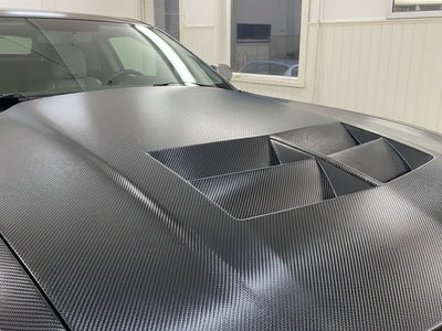Car wrapped in Hexis Gloss HX30000 Black Carbon Fiber restyling film HX30CA890B
