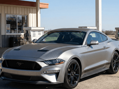 Ford Mustang wrapped in Hexis Gloss HX30000 Graphite Gray Carbon Fiber car wrap film HX30CAGGRB