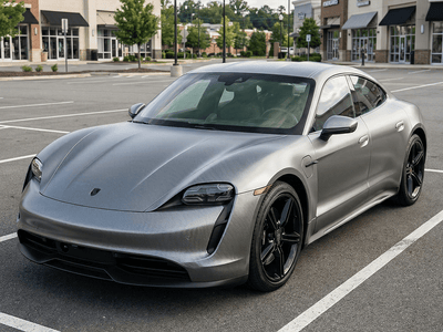 Porsche Taycan wrapped in Gloss HX30000 Graphite Gray Carbon Fiber wrap film HX30CAGGRB