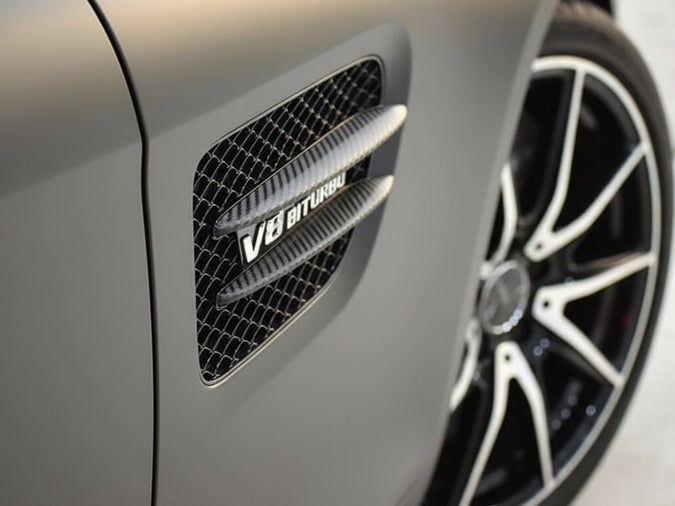 Hexis Skintac HX30 black high gloss carbon fiber wrap applied to vehicle exterior accent