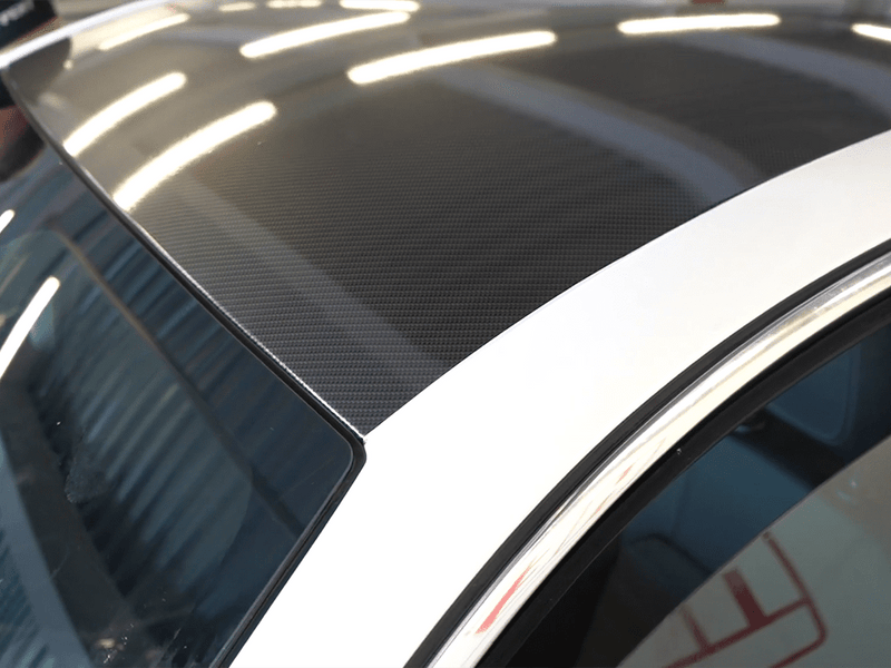 Car wrapped in Hexis Gloss HX30000 Black Carbon One Carbon Fiber wrap film HX30CANPEB
