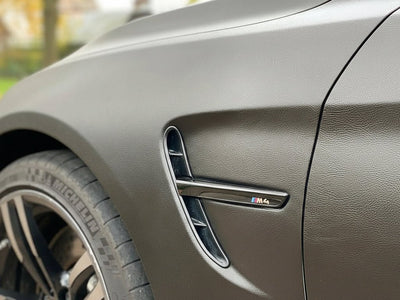 BMW M4 wrapped in None HX30000 Black Fine Grain Leather restyling film HX30PG889B
