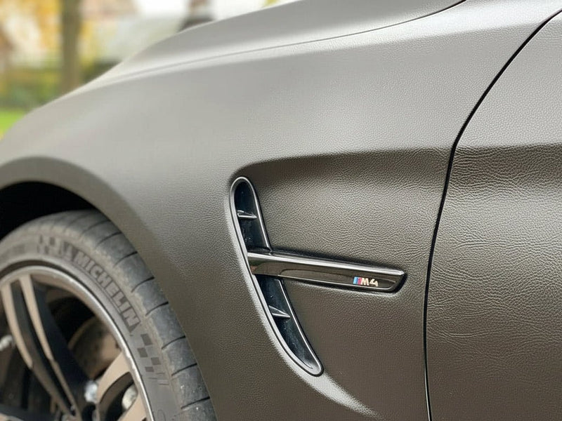 BMW M4 wrapped in None HX30000 Black Fine Grain Leather restyling film HX30PG889B