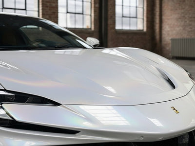 Ferrari SF90 wrapped in Hexis Gloss HX30000 White Rainbow restyling film HX30RW002B