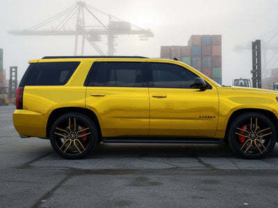 Chevrolet Tahoe wrapped in Gloss HX30000 Super Chrome Gold automotive vinyl film HX30SCH07B