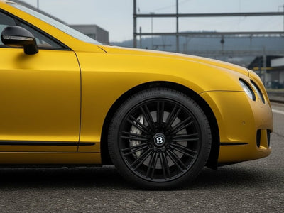 Bentley Continental GT wrapped in Satin HX30000 Super Chrome Gold restyling film HX30SCH07S
