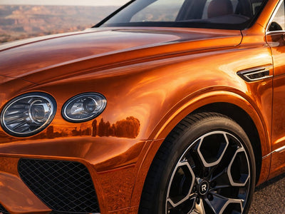 Bentley Bentayga wrapped in Gloss HX30000 Super Chrome Orange restyling film HX30SCH08B