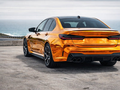 BMW M5 wrapped in Hexis Gloss HX30000 Super Chrome Orange vinyl wrap HX30SCH08B