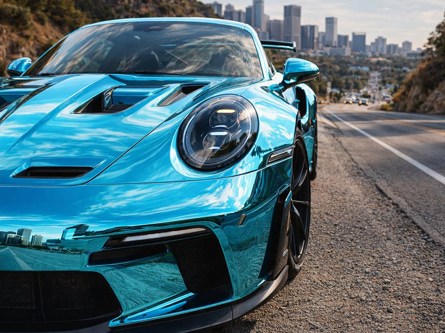 Porsche 911 wrapped in Gloss HX30000 Super Chrome Light Blue wrap film HX30SCH11B