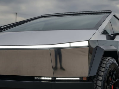 Tesla Cybertruck wrapped in Hexis Gloss HX30000 Super Chrome Ebony Black restyling film HX30SCH13B