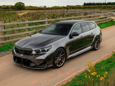 BMW 5 Series Touring wrapped in Hexis Gloss HX30000 Super Chrome Ebony Black car wrap film