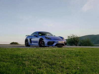 Porsche 718 Cayman GT4 wrapped in Super Gloss Pearlescent Pearl Lavender vinyl wrap