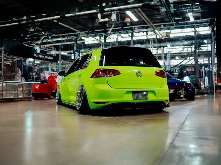 Volkswagen Golf wrapped in Super Gloss Acid Green restyling film