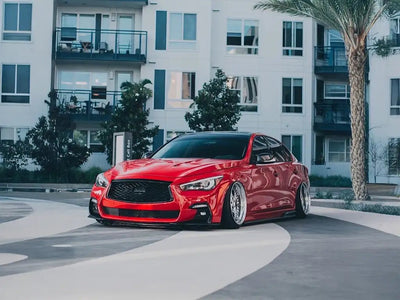 Infiniti Q50 wrapped in SuperGloss Blood Red automotive vinyl film
