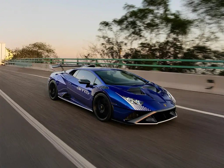 Lamborghini Huracán STO wrapped in SuperGloss Metallic Blueberry vinyl wrap