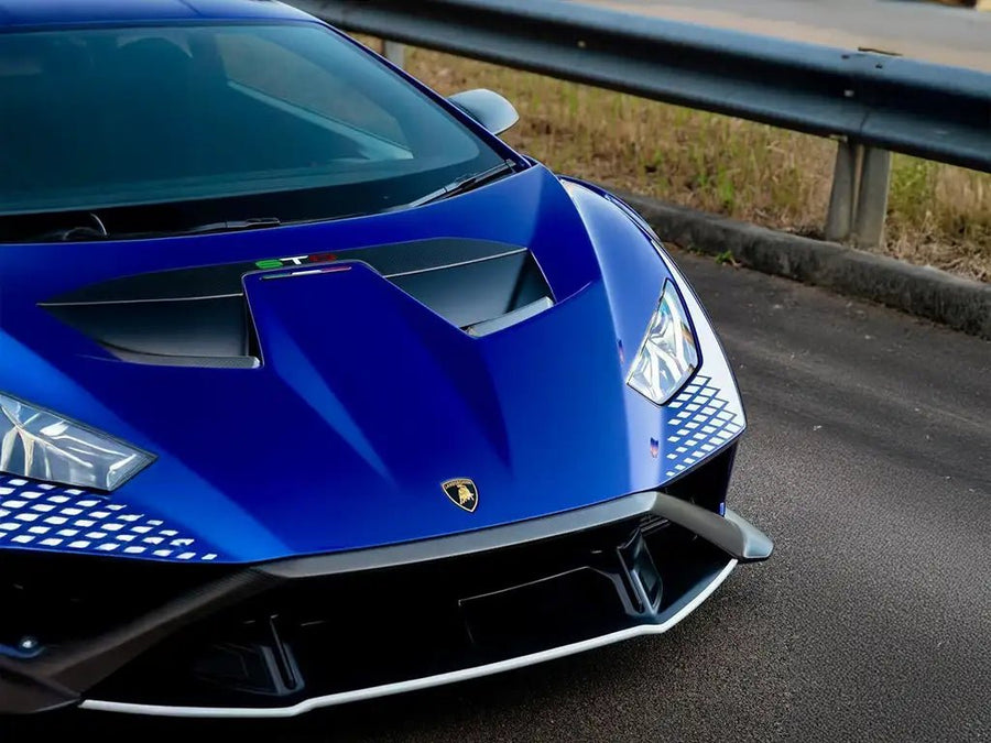 Lamborghini Huracán STO wrapped in SuperGloss Metallic Blueberry automotive vinyl film