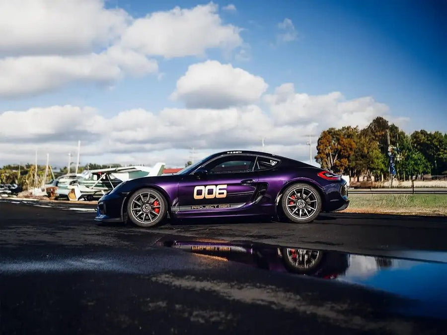 Porsche Cayman wrapped in Inozetek Super Gloss Metallic Midnight Purple vinyl wrap