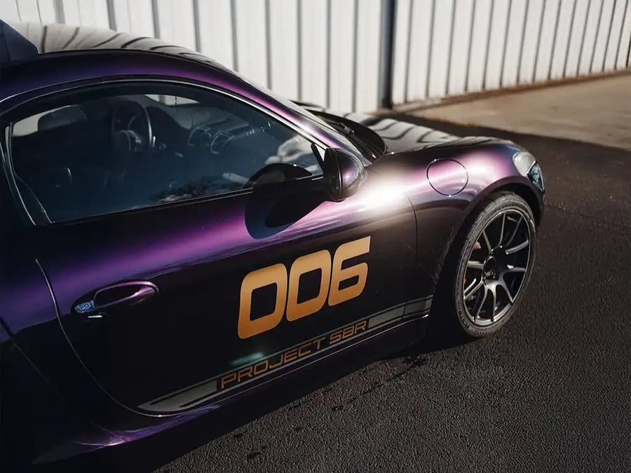 DIY Porsche Cayman wrapped in SuperGloss Metallic Midnight Purple wrap film