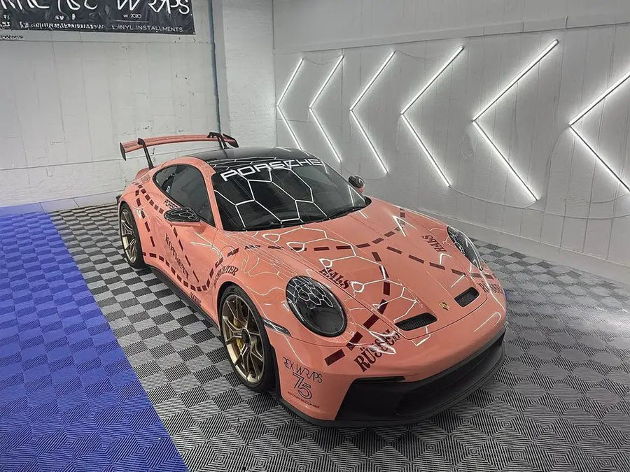 Porsche 911 GT3 wrapped in SuperGloss Piggy Bank automotive vinyl film