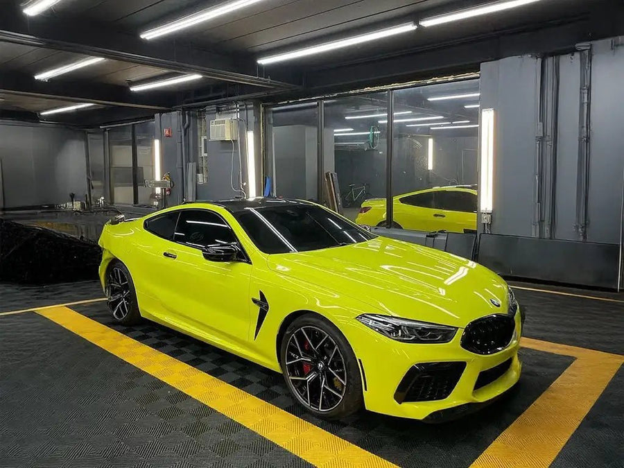 BMW M8 wrapped in SuperGloss Racing Yellow wrap film