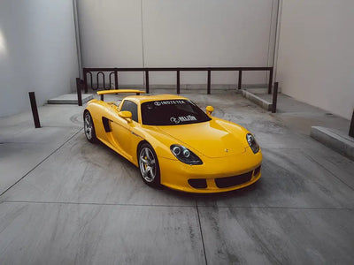 Porsche Carrera GT wrapped in Super Gloss Signal Yellow restyling film