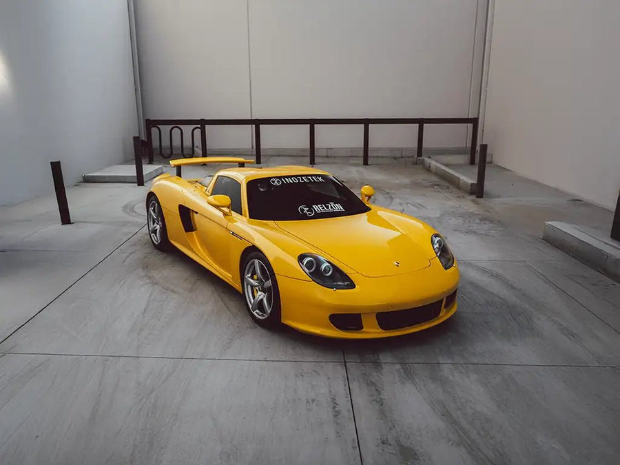 Porsche Carrera GT wrapped in Super Gloss Signal Yellow restyling film