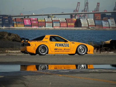 Mazda RX-7 FC wrapped in Super Gloss Signal Yellow wrap film