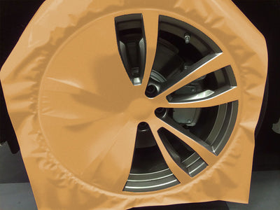 Oracal Wheel Being Wrapped in Matte Metallic Pyrite Film